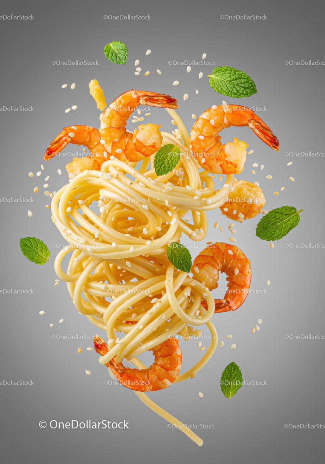Spaghetti with shrimp, sesame seeds, and fresh mint leaves