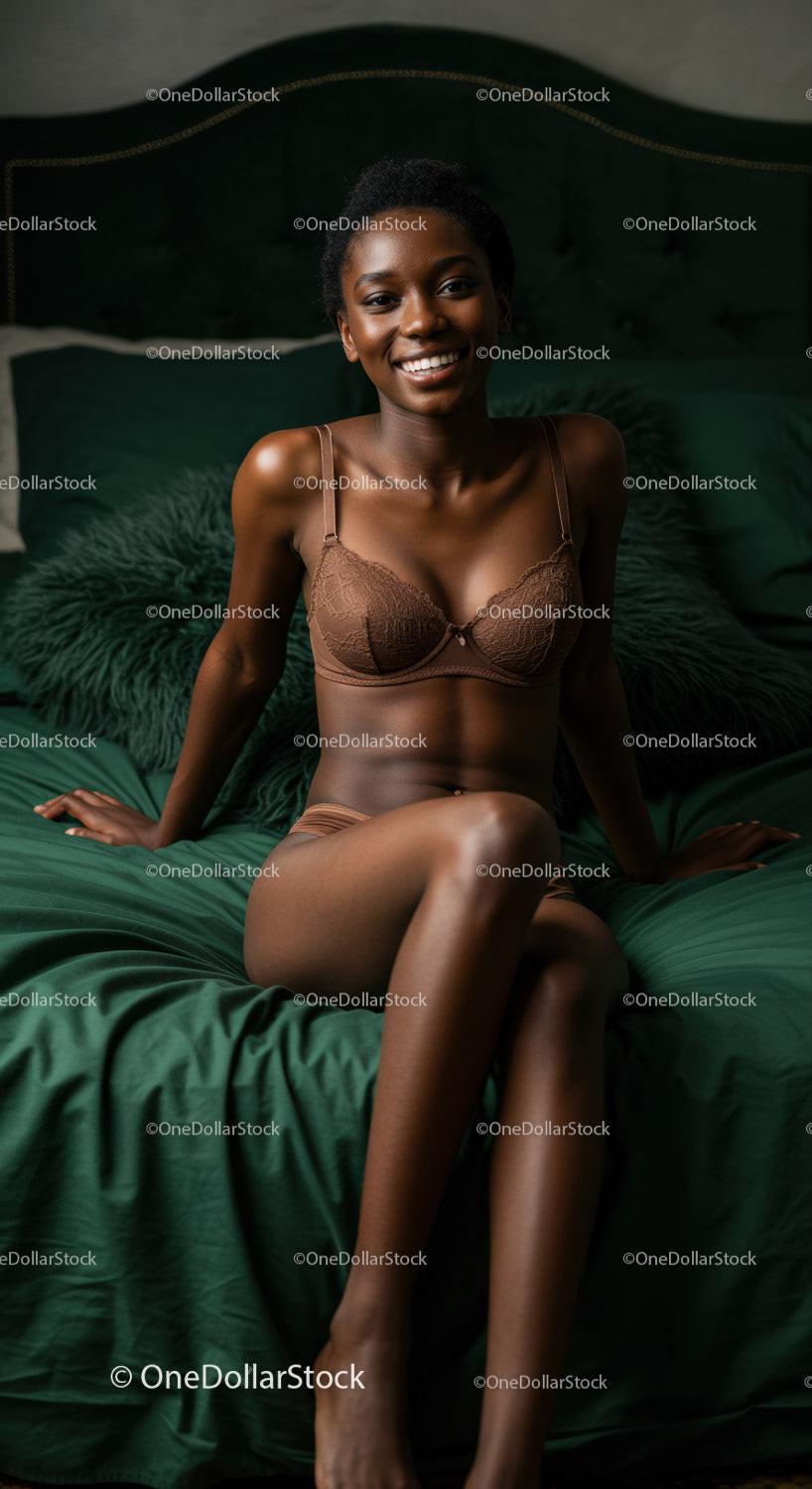 Smiling woman relaxed on dark green bed linen