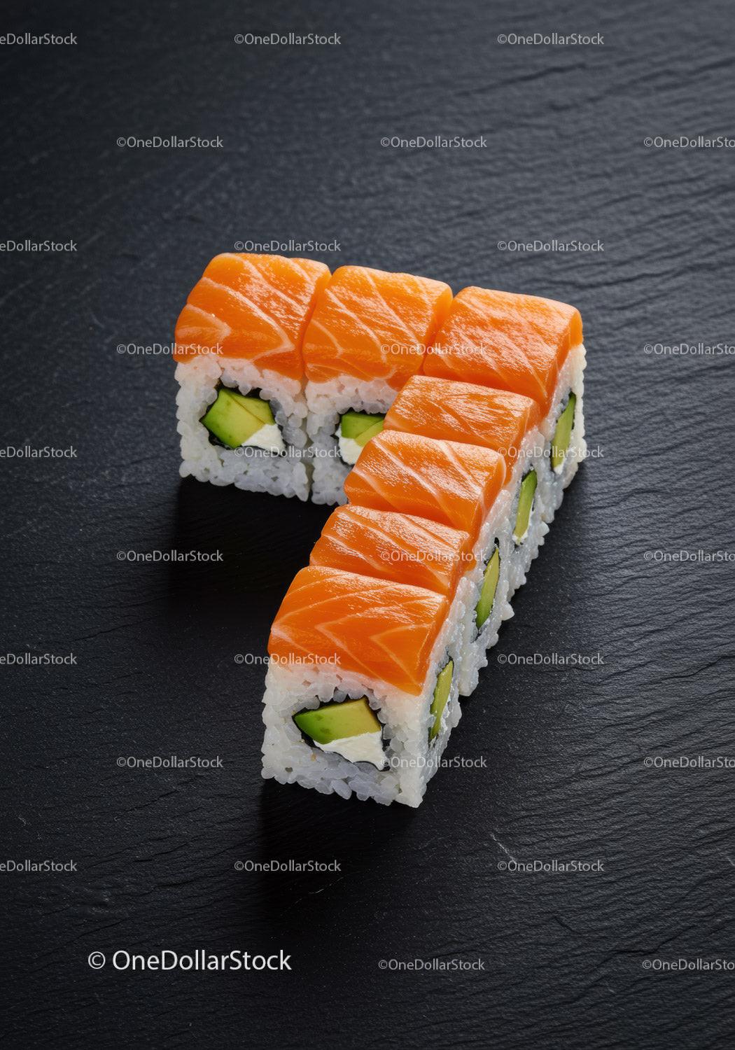 Fresh salmon sushi rolls with avocado on slate plate