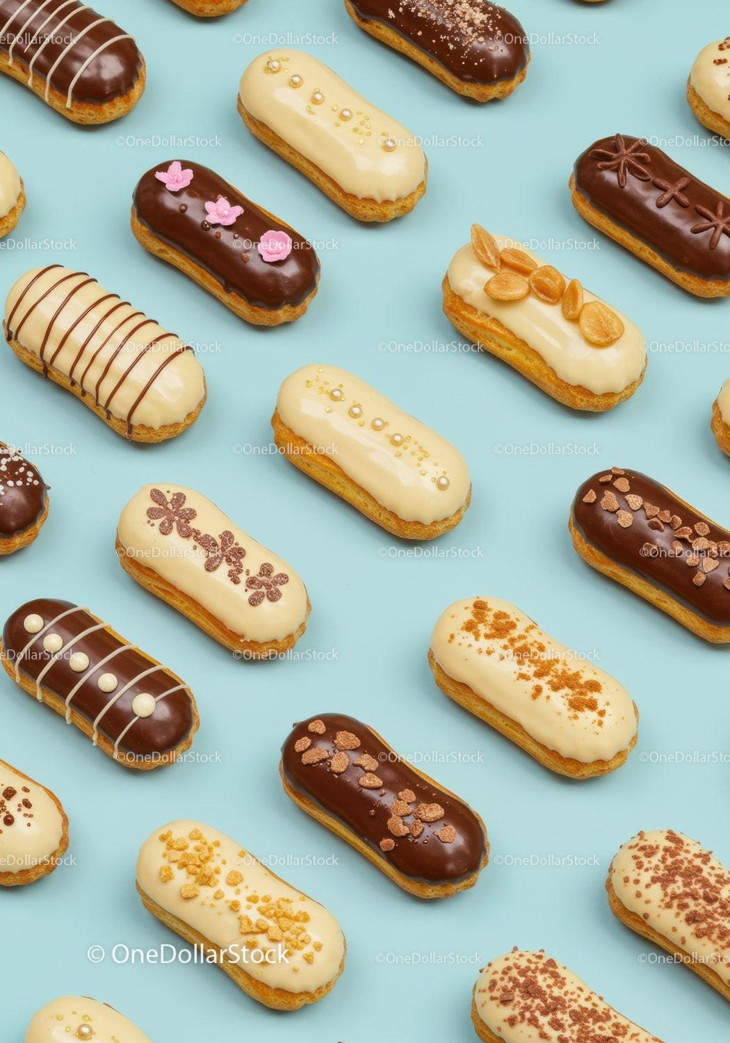 Assorted gourmet eclairs with elegant toppings on blue