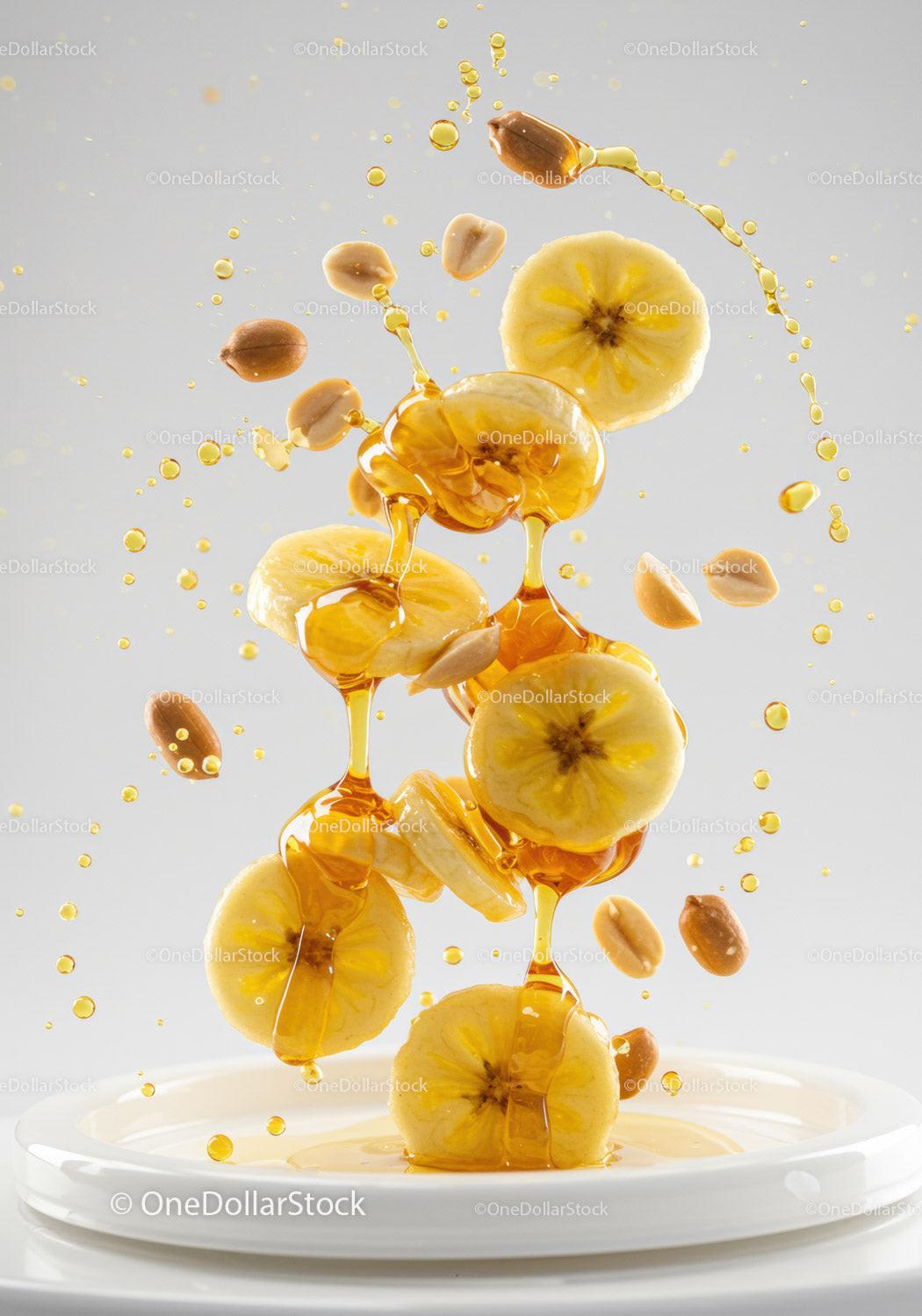 Banana slices and peanuts drizzled with golden honey