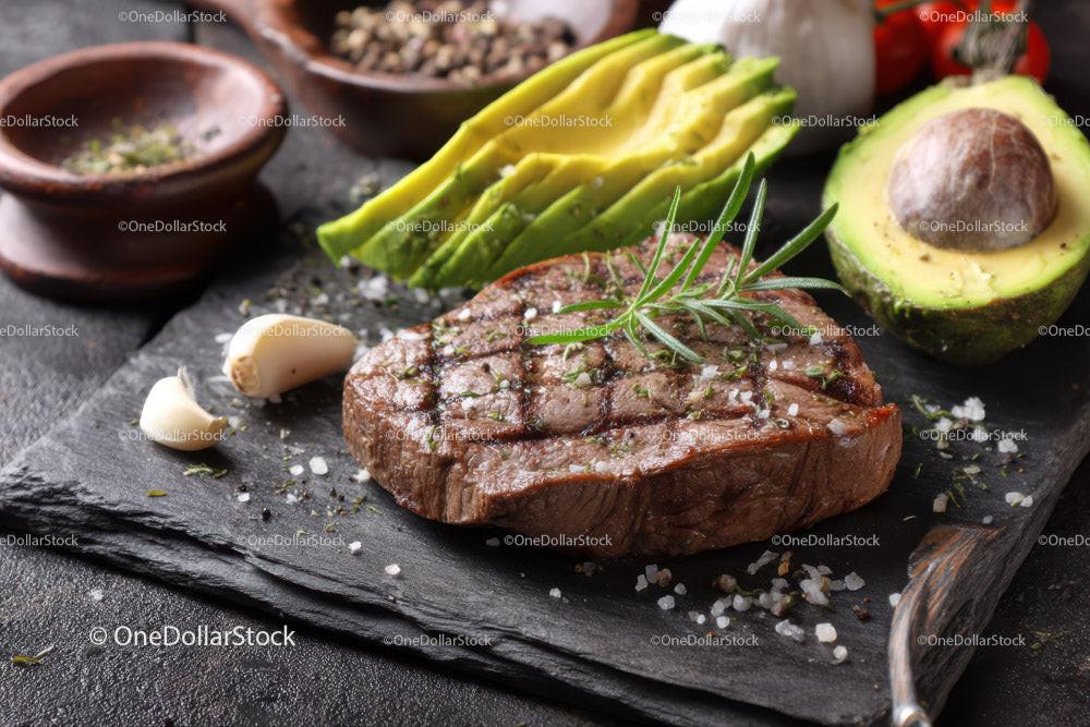 Juicy Grilled Steak with Fresh Avocado and Garlic on Rustic Board Stock Photo Bundle preview 19