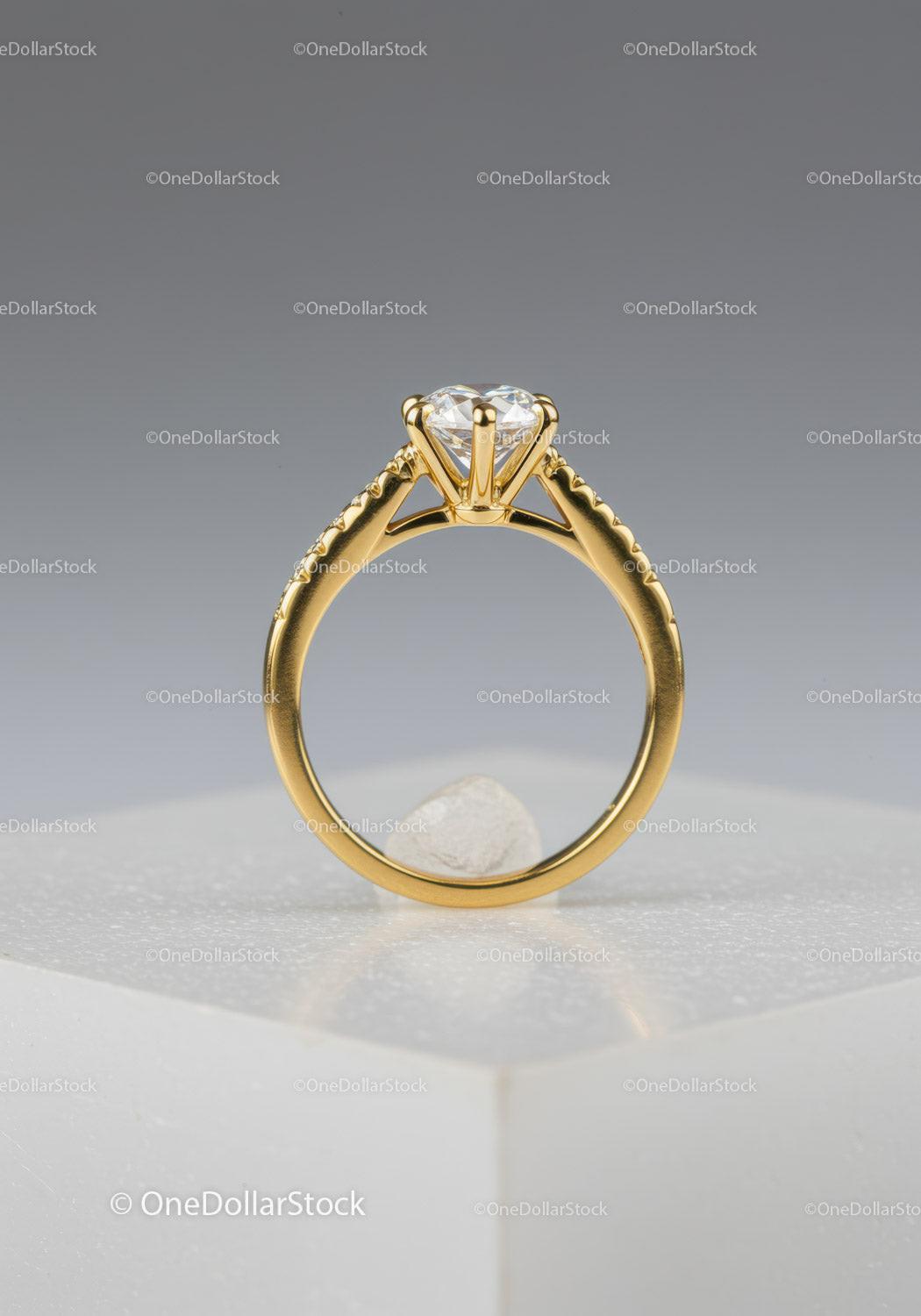 Gold Engagement Ring with Solitaire Diamond on Elegant Display