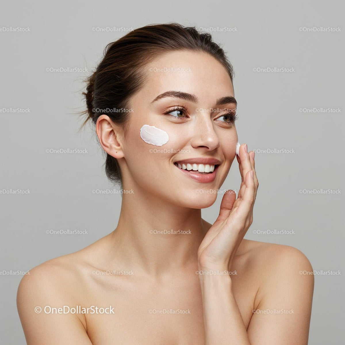 Elegant Woman Applying Facial Cream for Healthy Radiant Skin