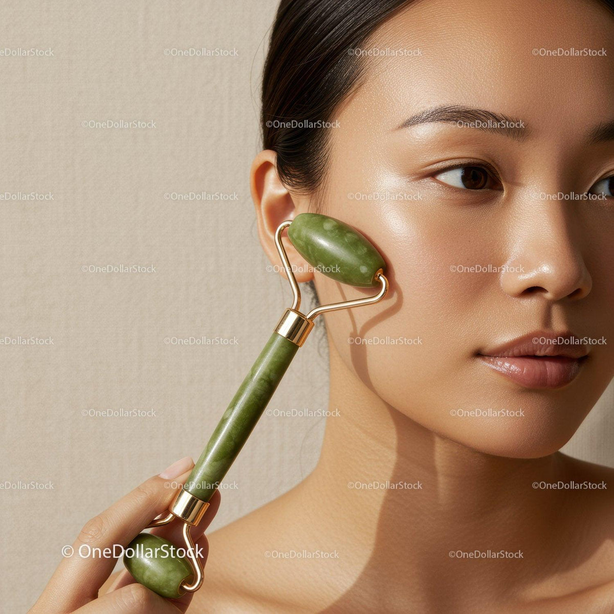 Elegant Woman Using Green Jade Facial Roller for Skin Rejuvenation