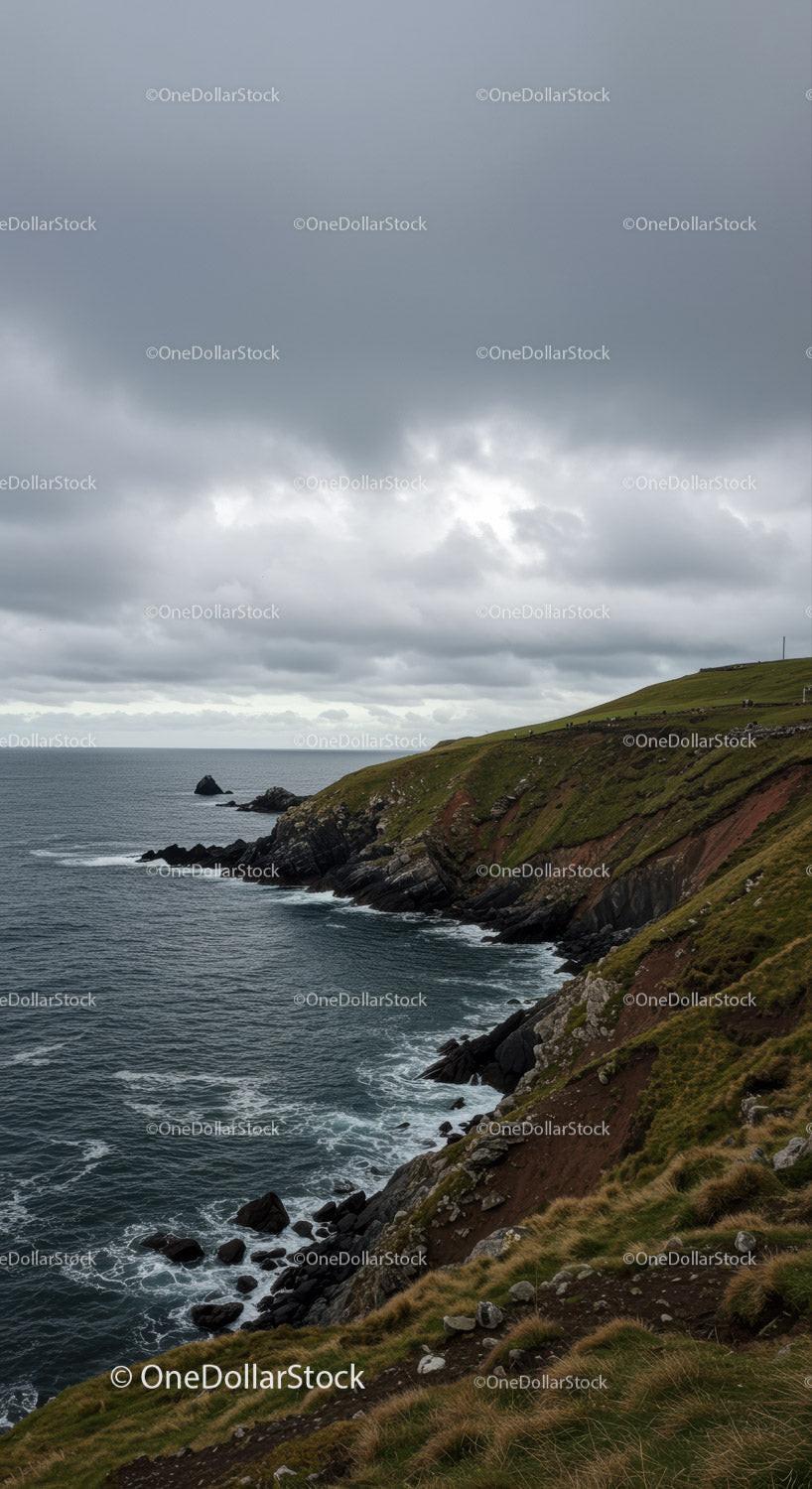 Dramatic Rocky Coastline Under Moody Overcast Sky