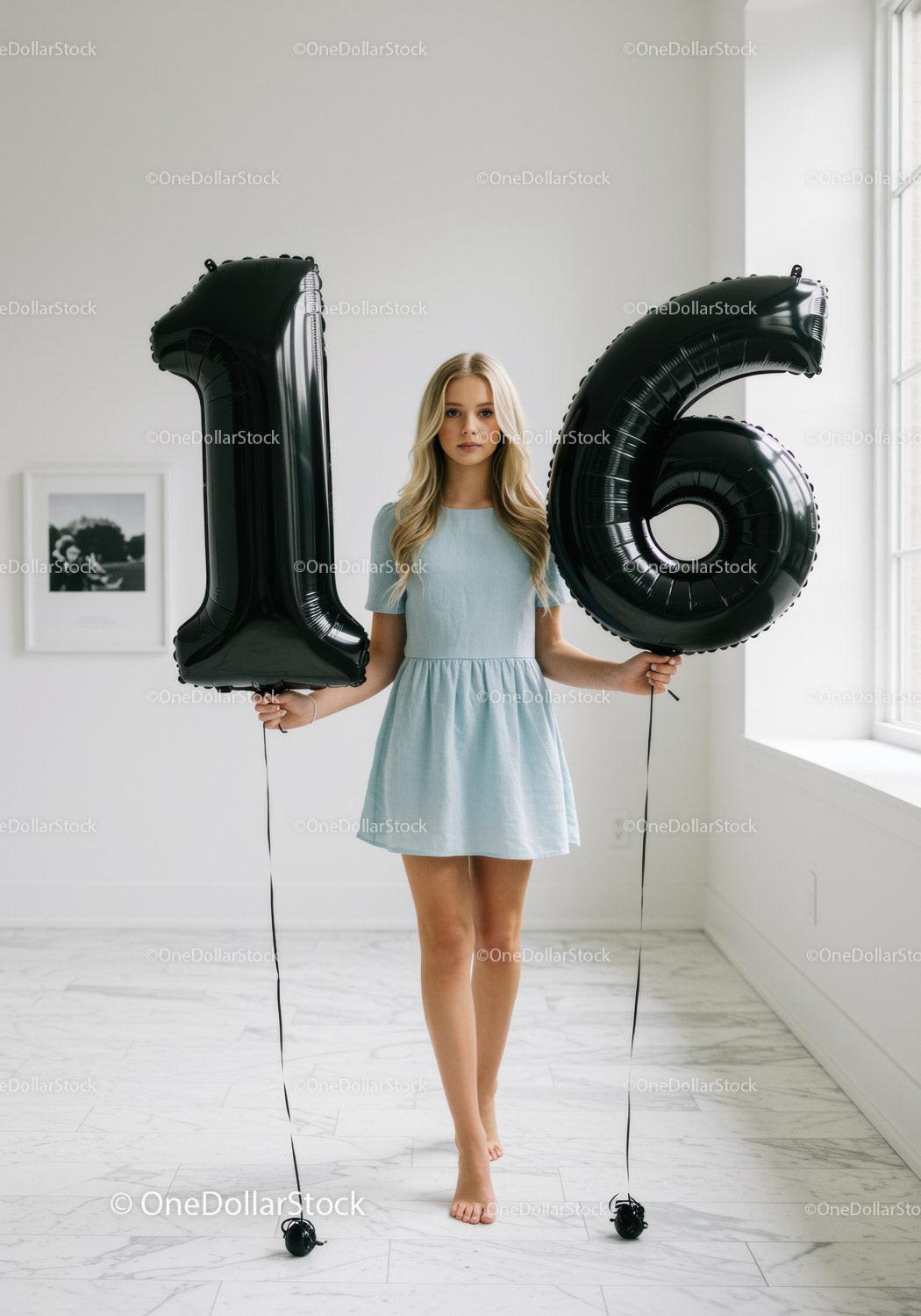 Teenage girl standing barefoot holding 16 balloons