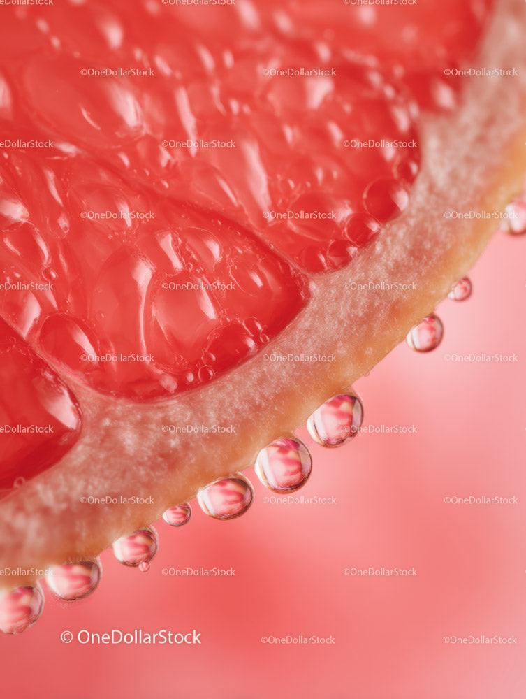 Close-up of Juicy Red Pomegranate Seed with Water Droplets
