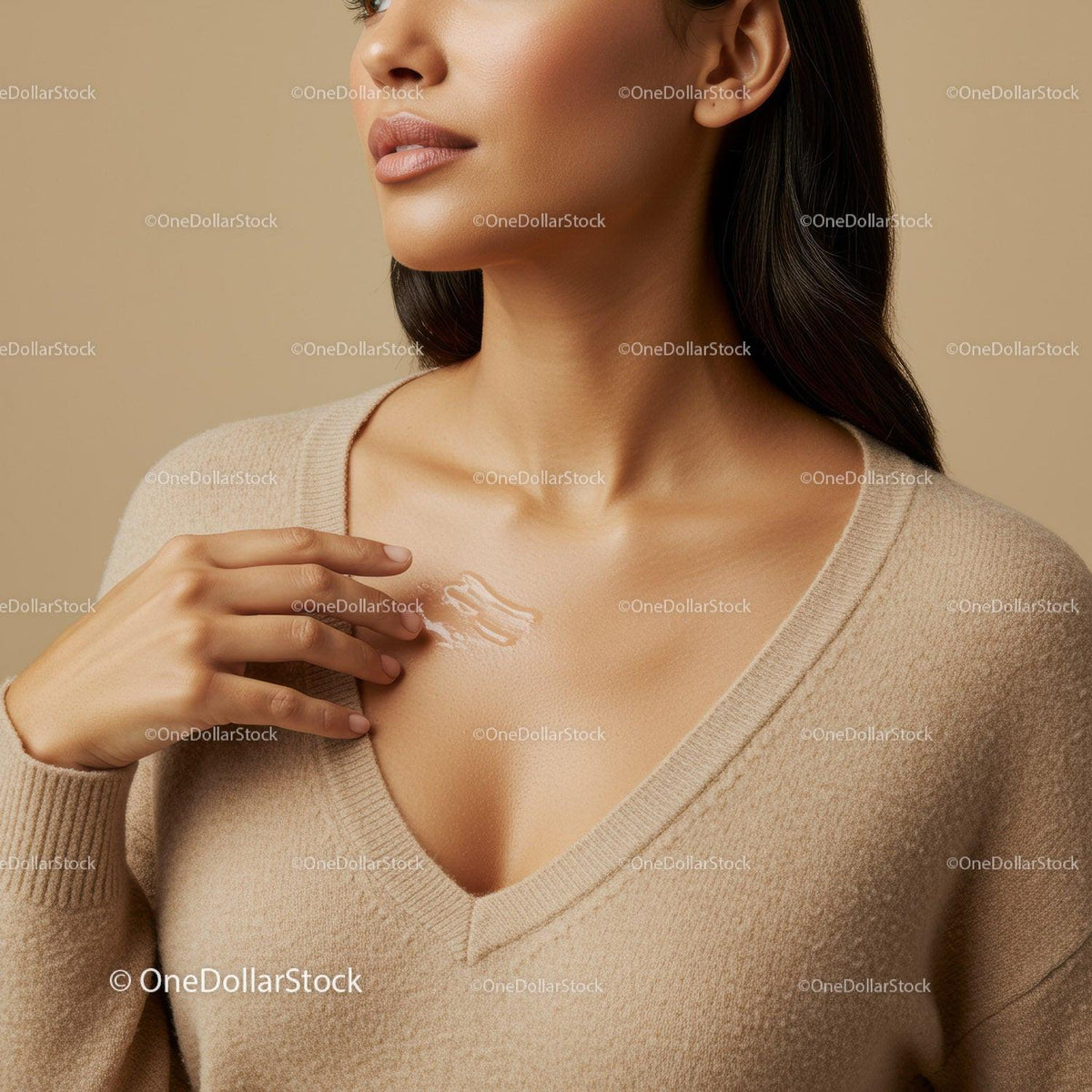 Close-Up of Woman Applying Cream to Collarbone for Healthy Skin