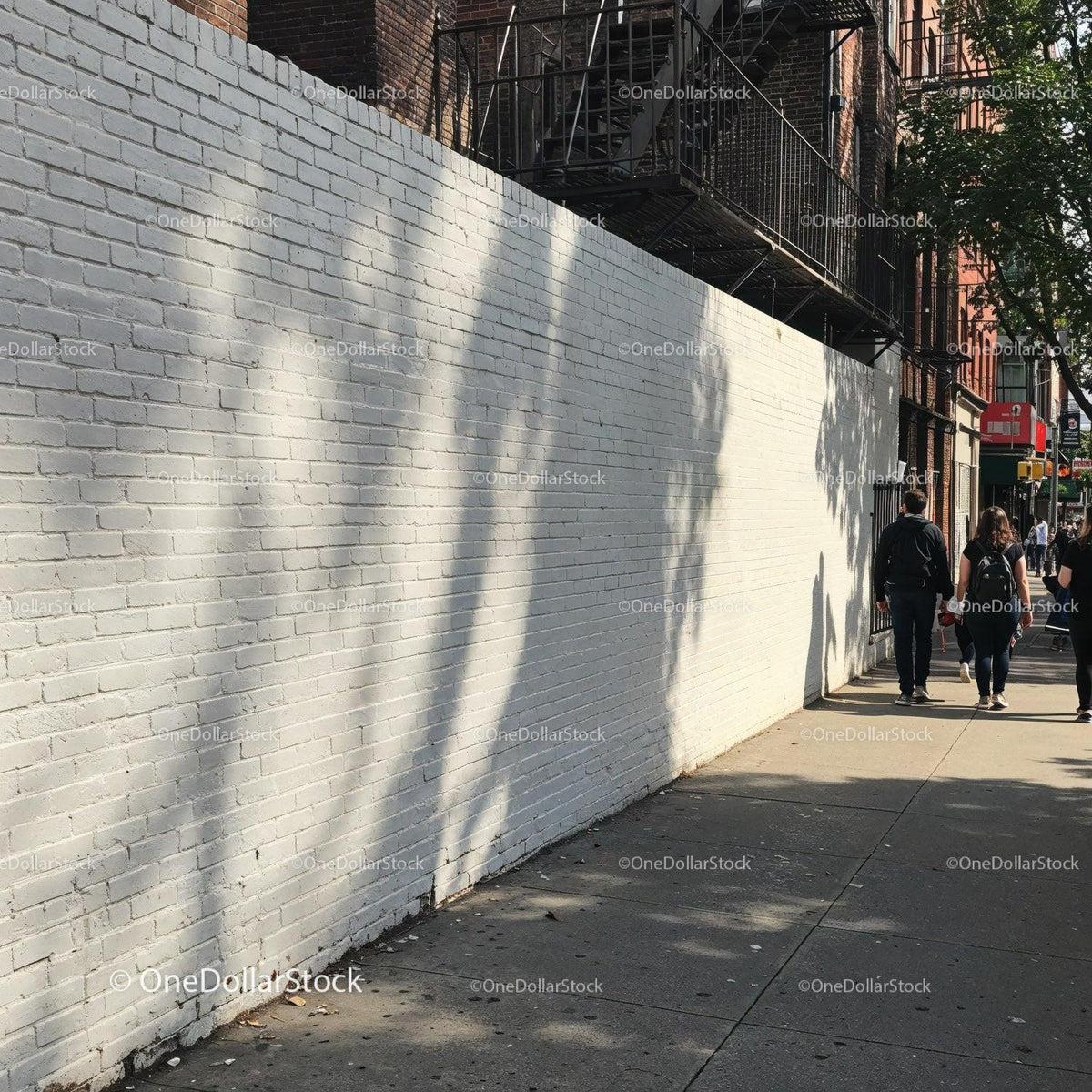 Shadows and Pedestrians on a White Brick Urban Street Wall JPG Mockup Image preview