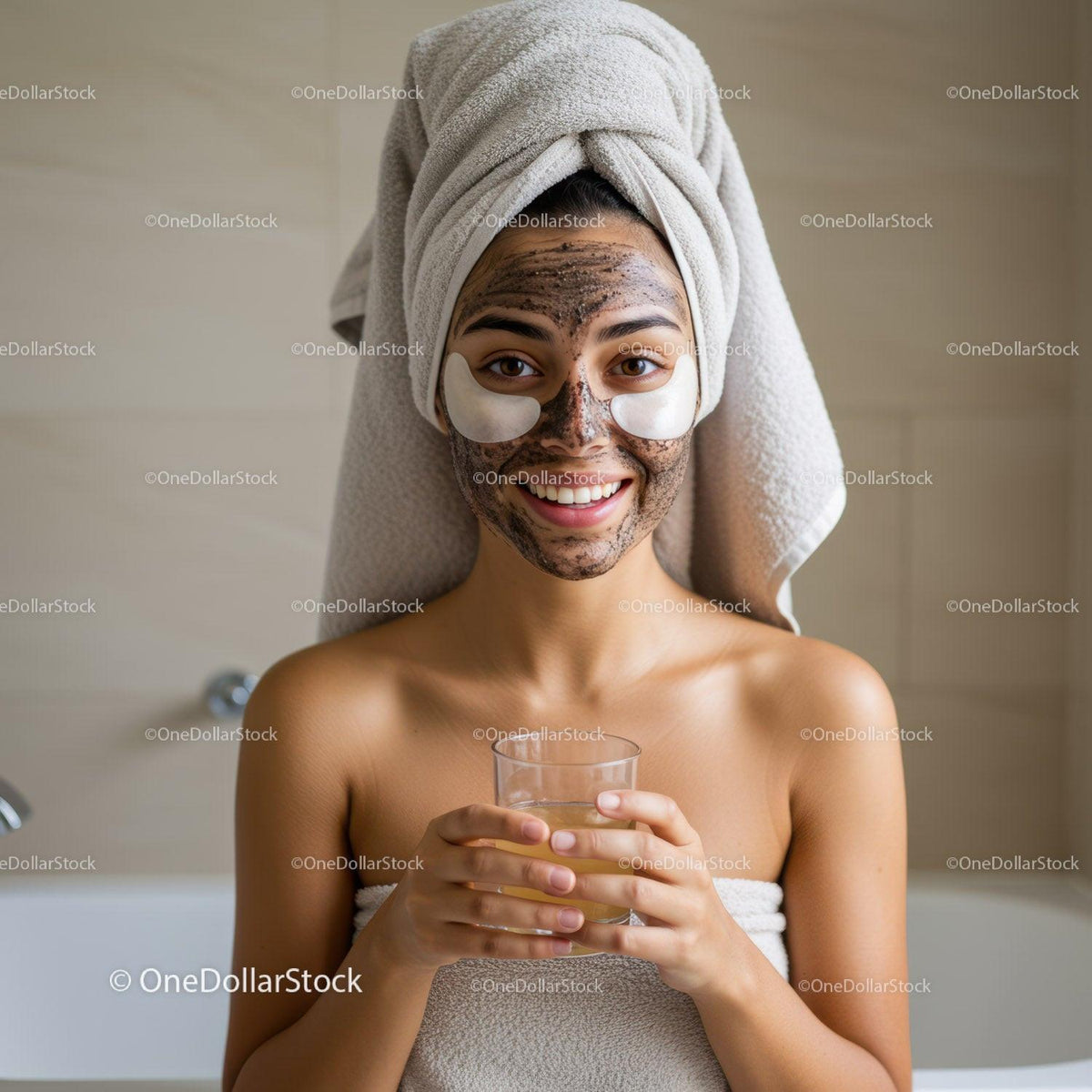 Young Woman with Facial Clay Mask and Towel Wrap Relaxing During Skincare Routine