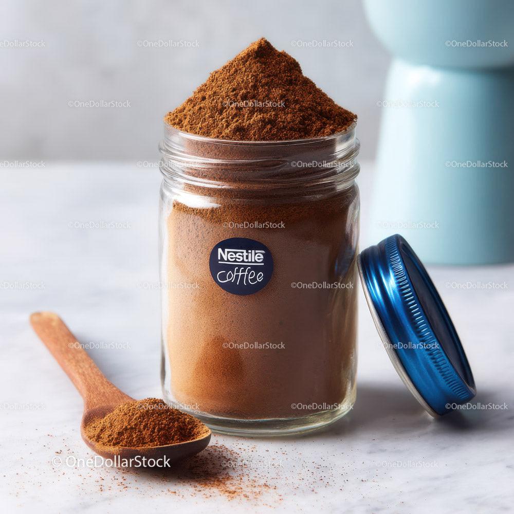 Ground Coffee in a Transparent Jar with a Wooden Spoon on White Surface