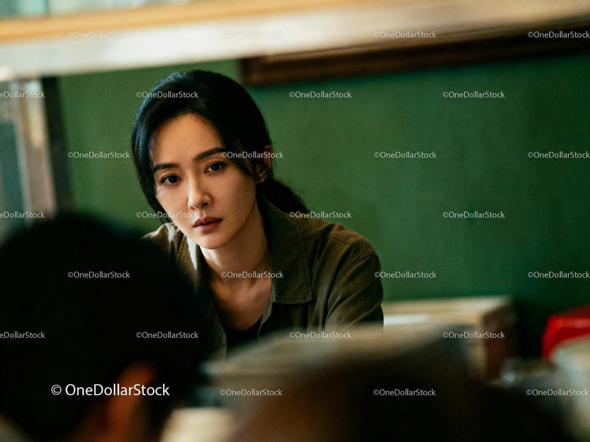 Young woman deeply focused in casual indoor setting