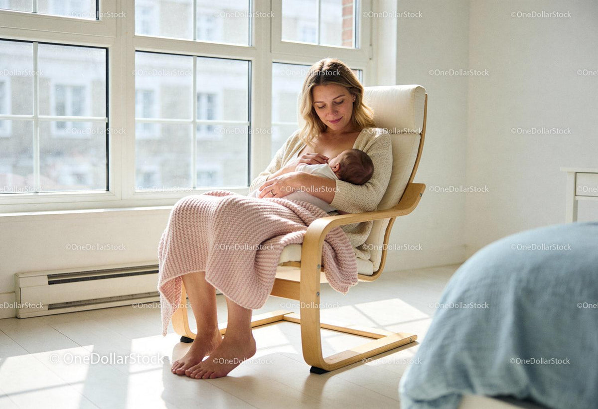 Mother breastfeeding newborn in a sunlit cozy room