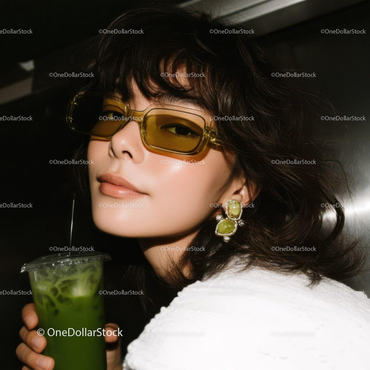 Stylish Woman Wearing Yellow Sunglasses with Green Cocktail