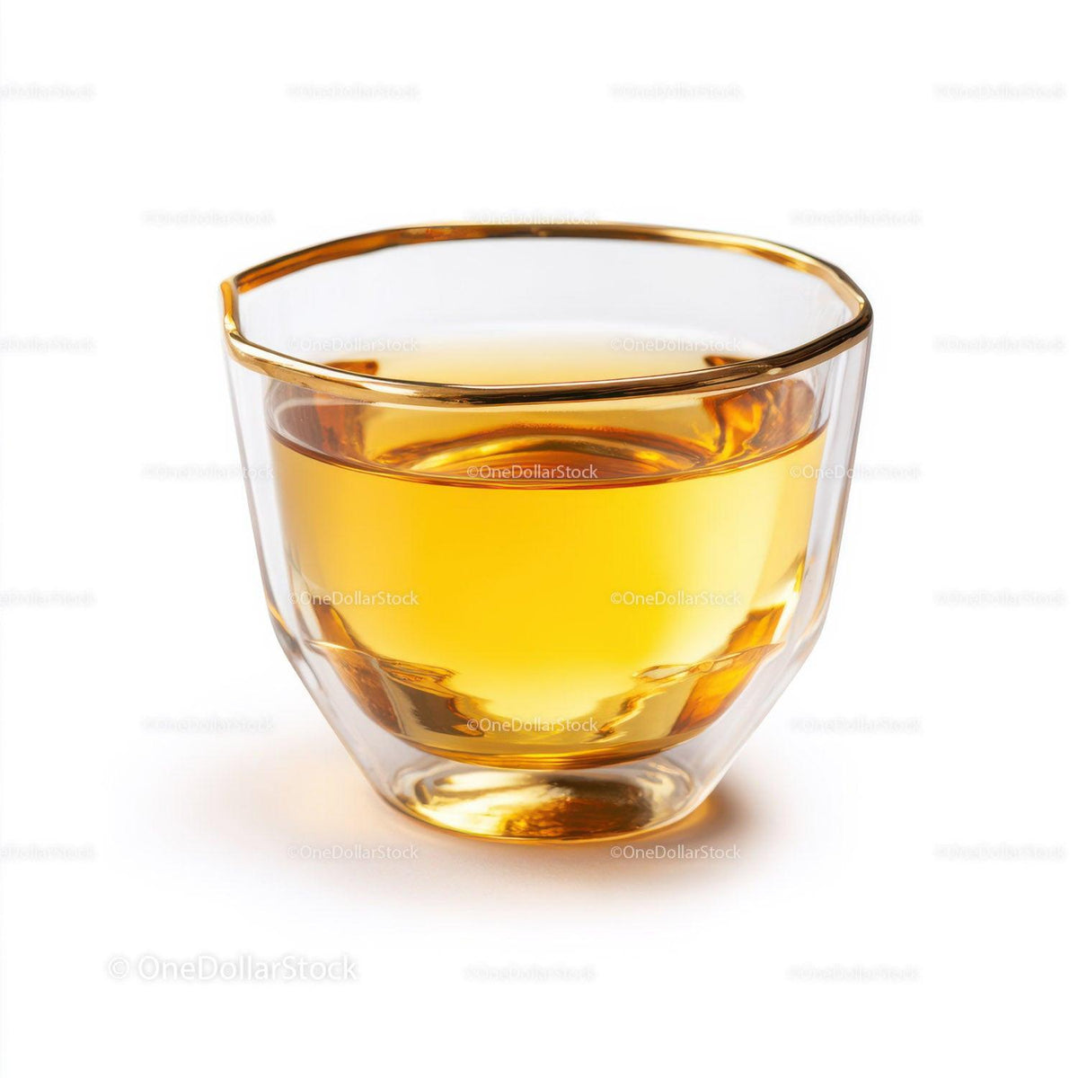 Clear double walled glass cup filled with amber liquid on white background