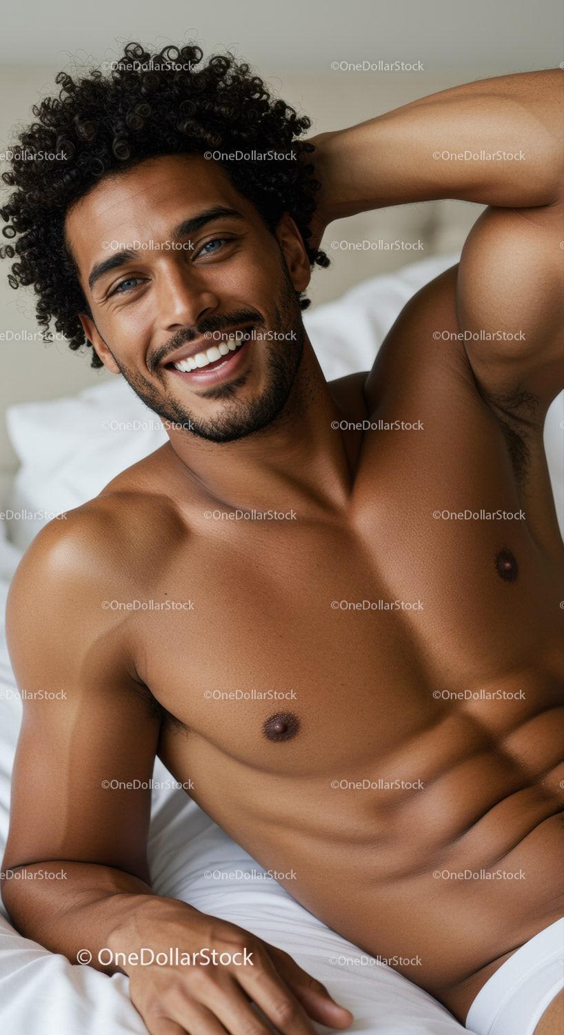 Smiling man relaxed on bed enjoying peaceful moment