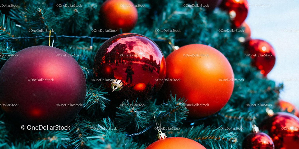 Close up of Christmas tree with red and orange ornaments