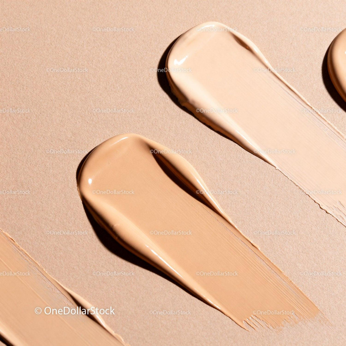 Close-up of Different Beige Foundation Swatches on Paper
