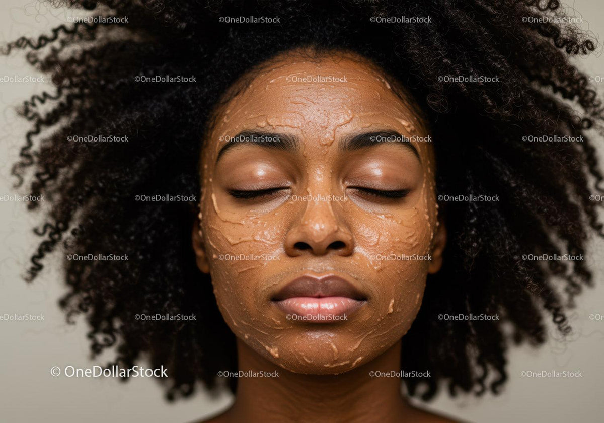Woman with Natural Curly Hair Applying a Face Mask for Skincare