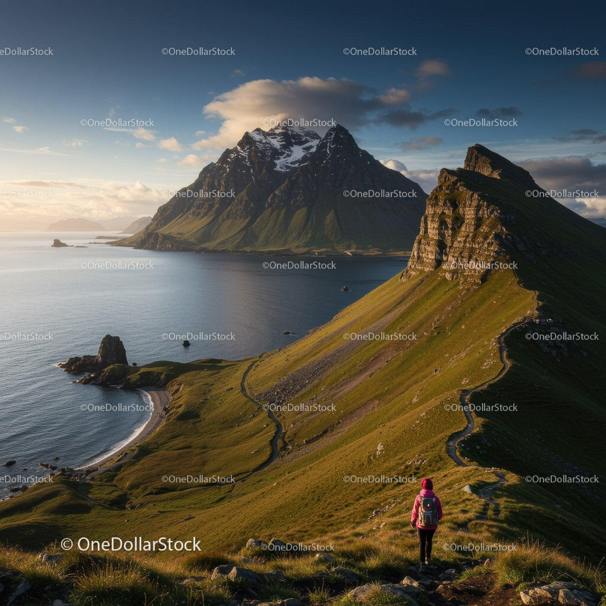 Majestic Mountain Range Over Scenic Coastal Landscape at Sunset