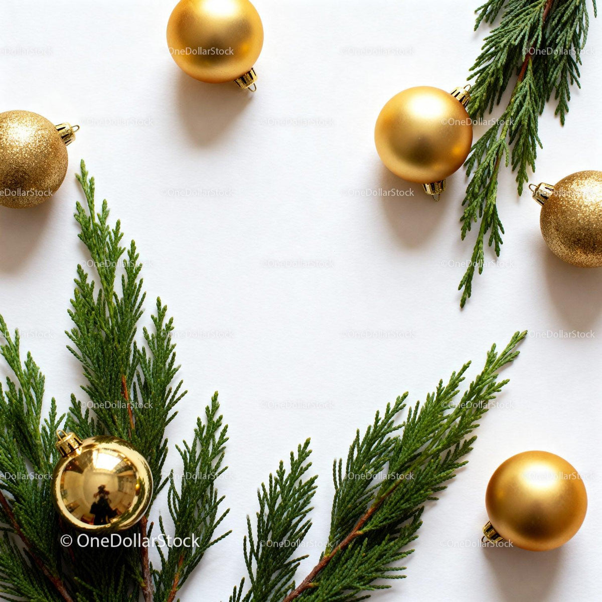 Elegant Gold Ornaments and Greenery on White Background