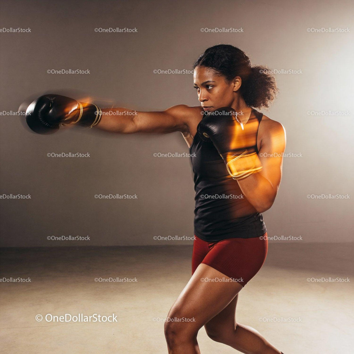 Focused woman boxing with intense motion blur effect