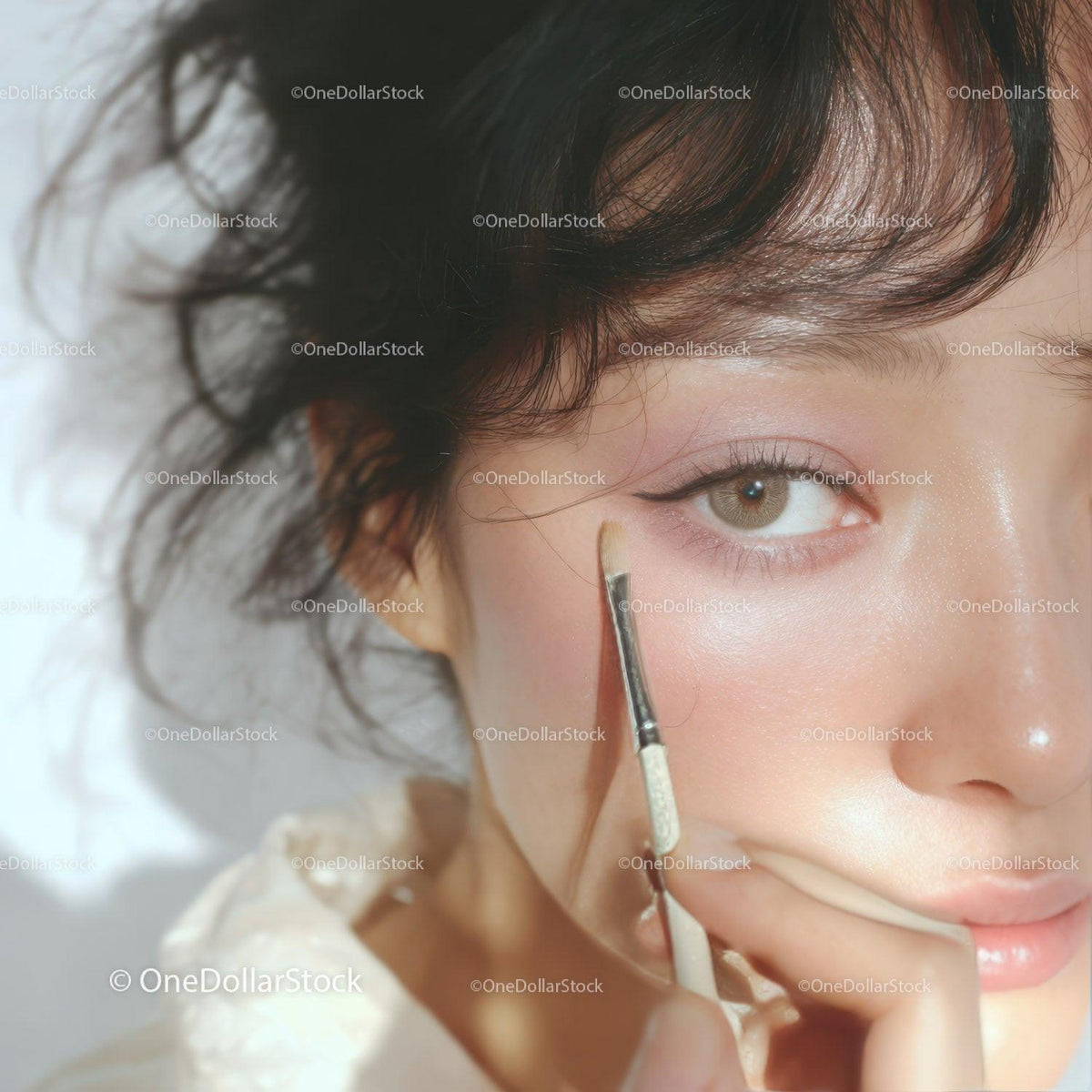 Close-up of Woman Applying Eye Makeup with Brush