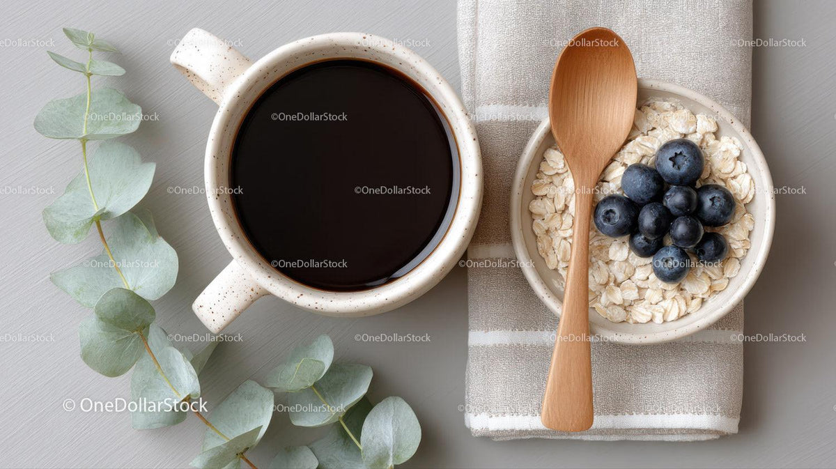 Coffee Cup and Oatmeal Bowl with Blueberries on Cozy Kitchen Table