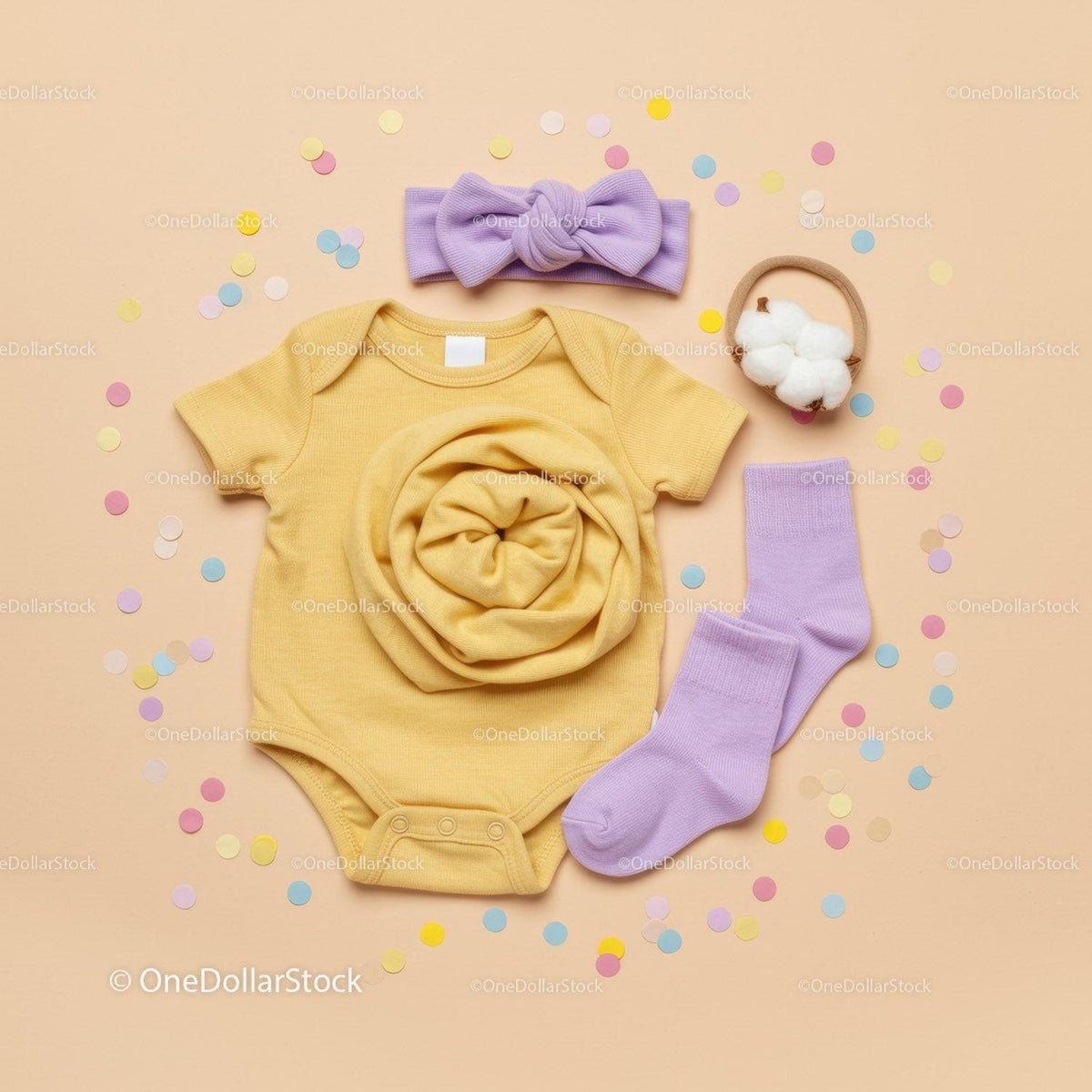 Soft yellow baby bodysuit with pastel accessories set