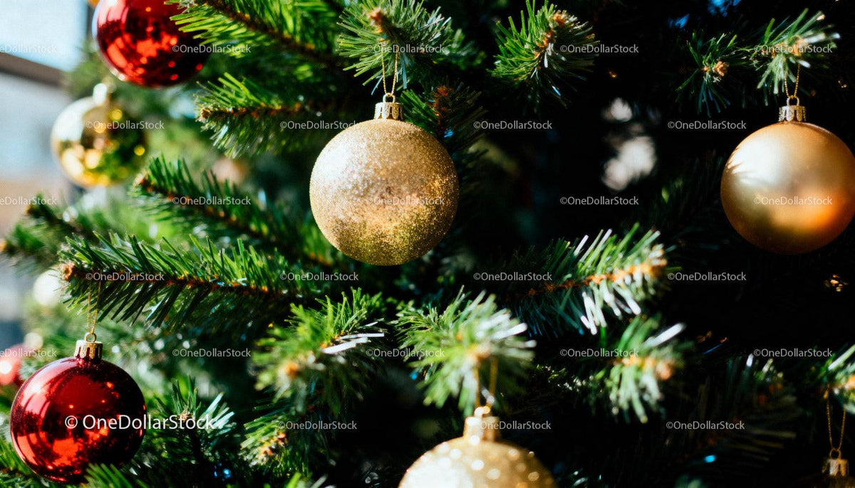 Closeup of colorful baubles on a green Christmas tree