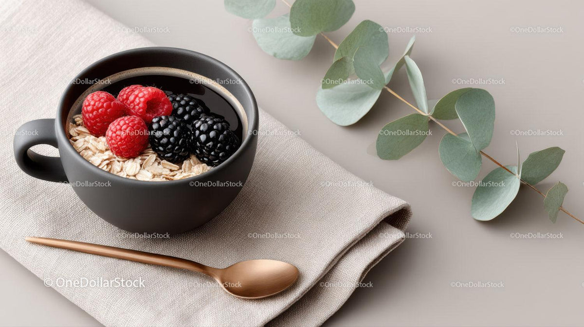 Fresh Berry Breakfast in Black Mug with Oatmeal and Greenery