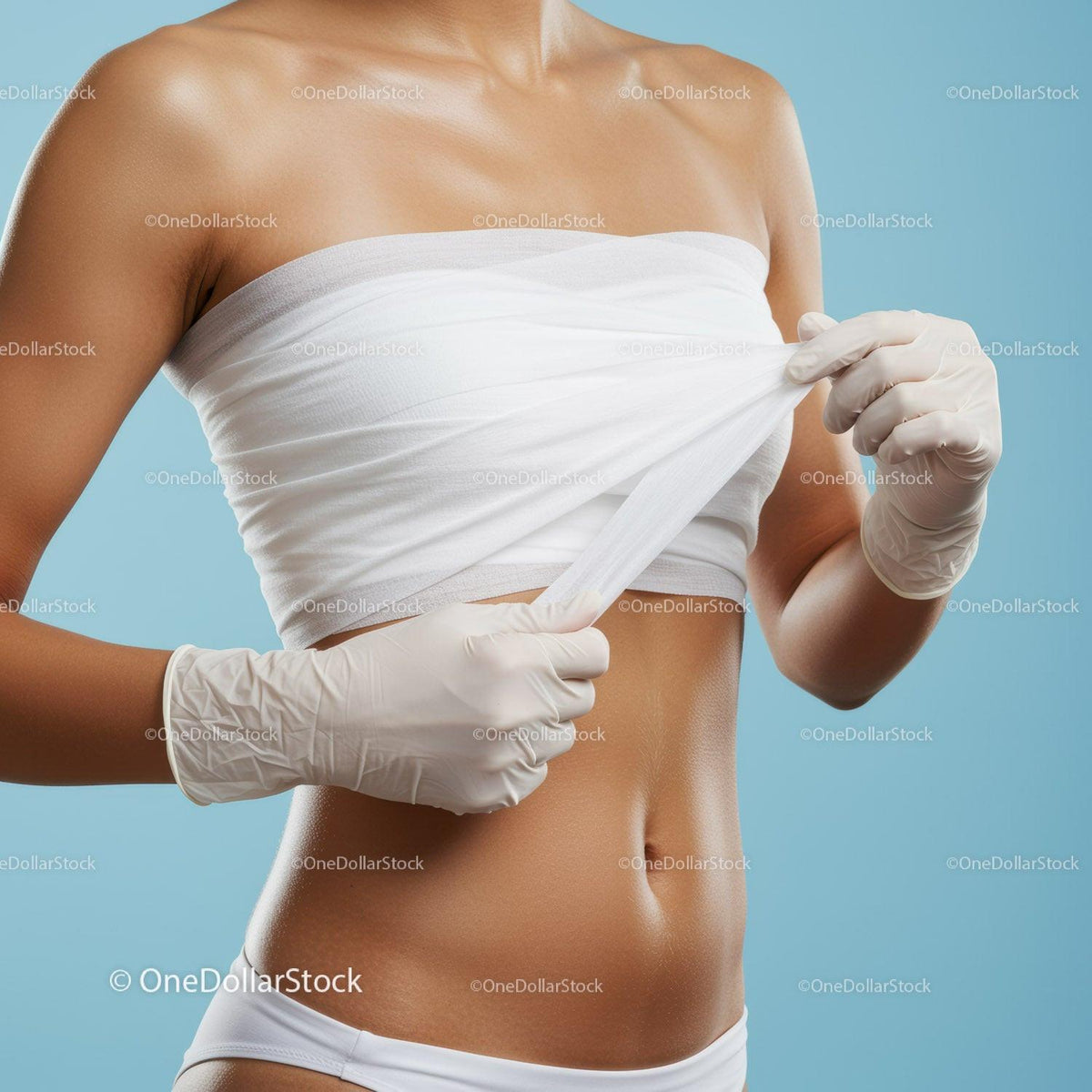 Woman Removing Bandage from Her Bare Shoulder and Arm