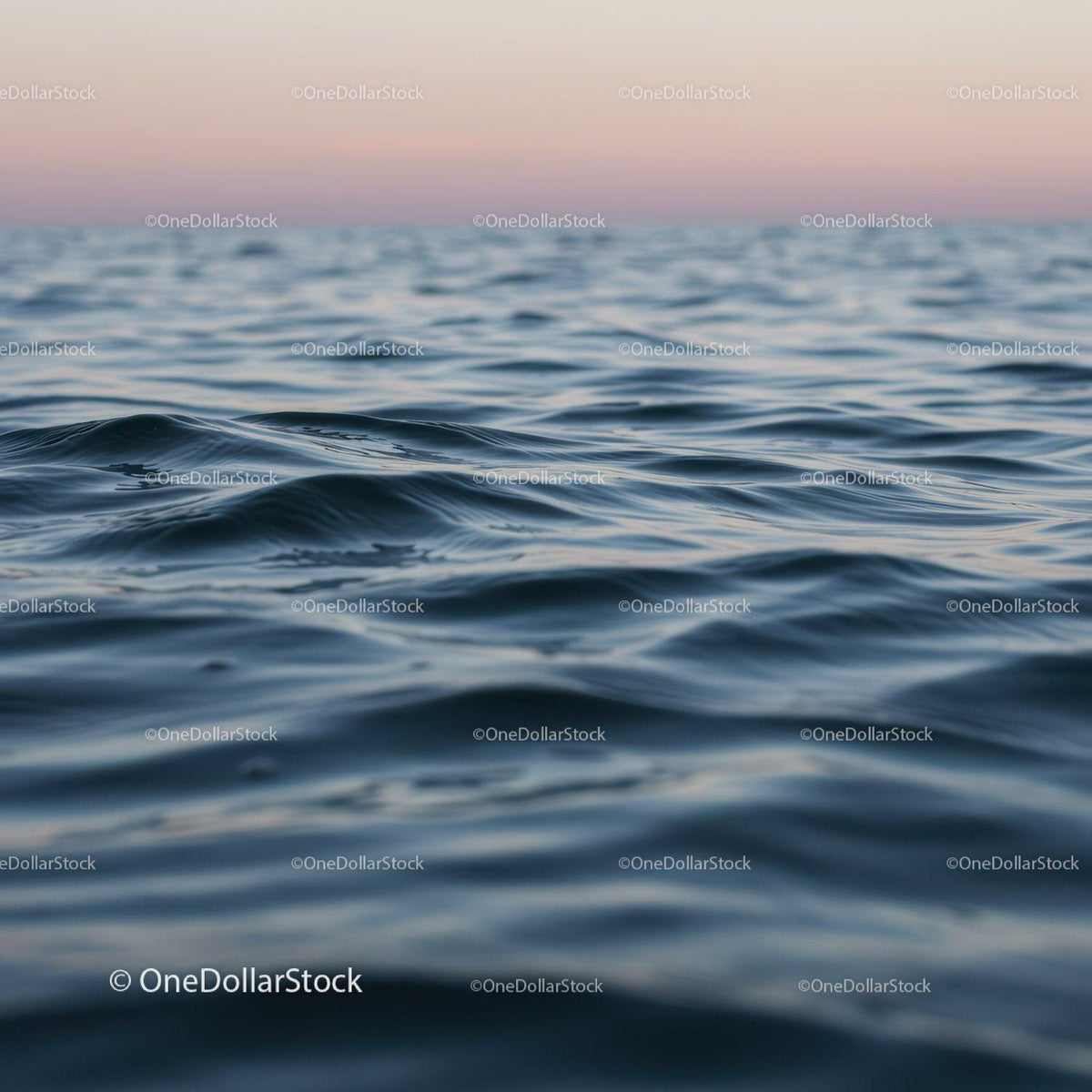 Calm Ocean with Gentle Waves at Sunset
