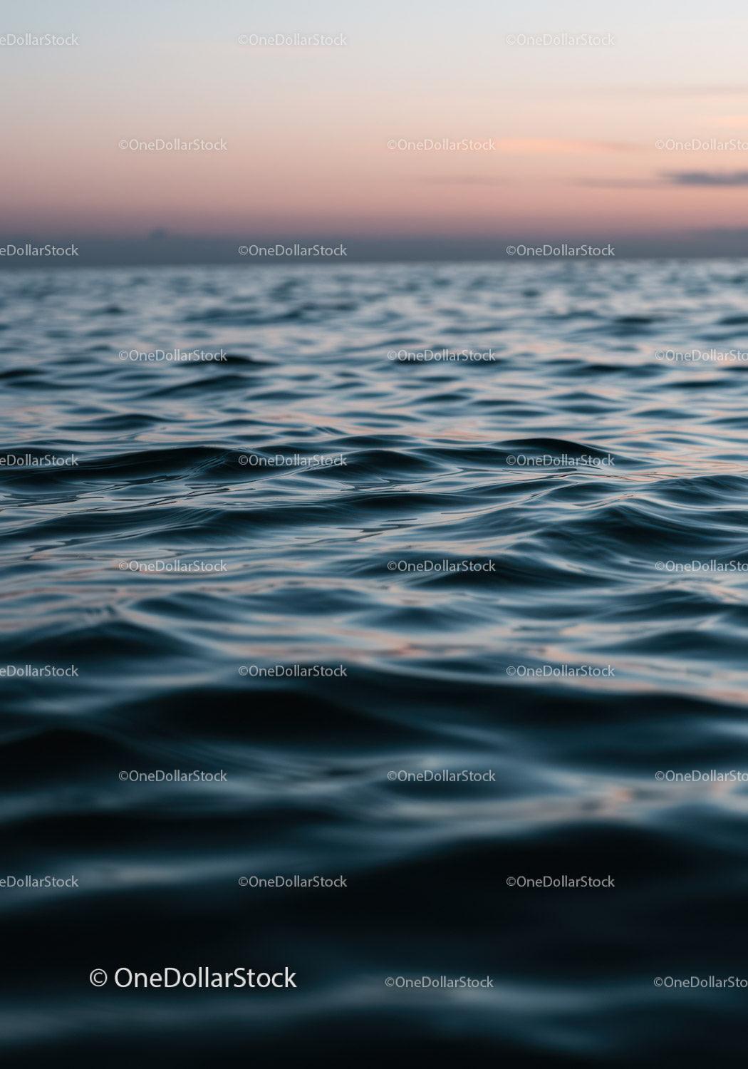 Serene Ocean Sunset with Gentle Ripples and Pastel Sky