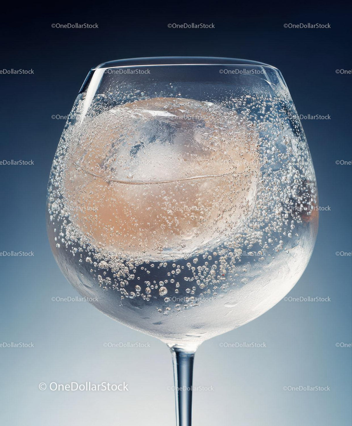 Elegant Champagne Glass with Ice Cube and Bubbles in Studio Scene