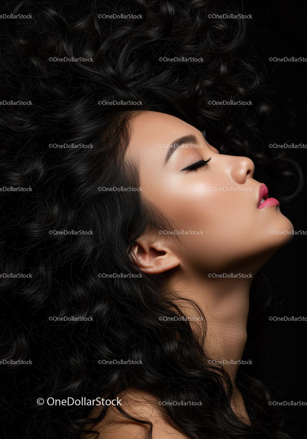 Profile of serene woman with curly hair and closed eyes