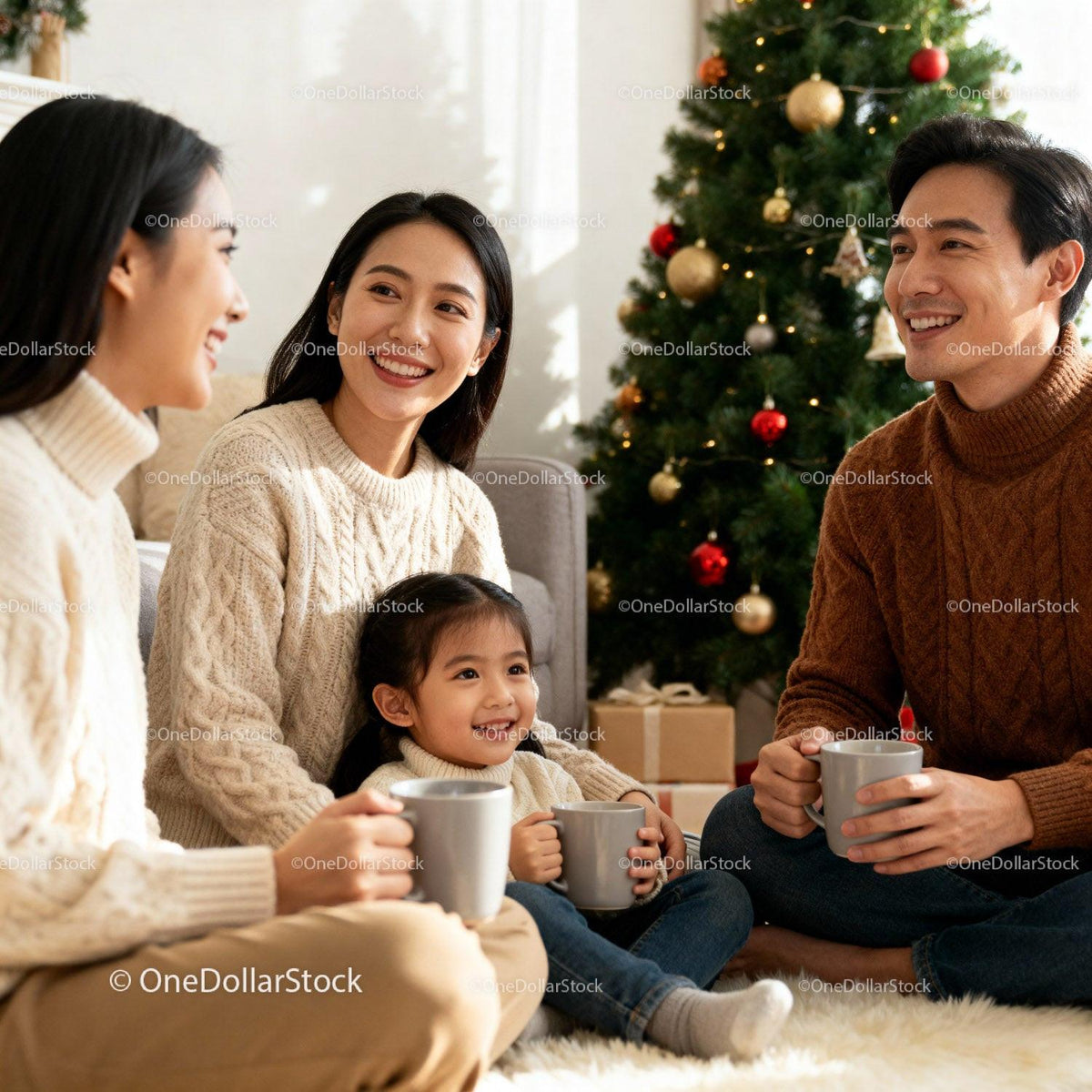 Family Enjoying Warm Drinks Together by Christmas Tree