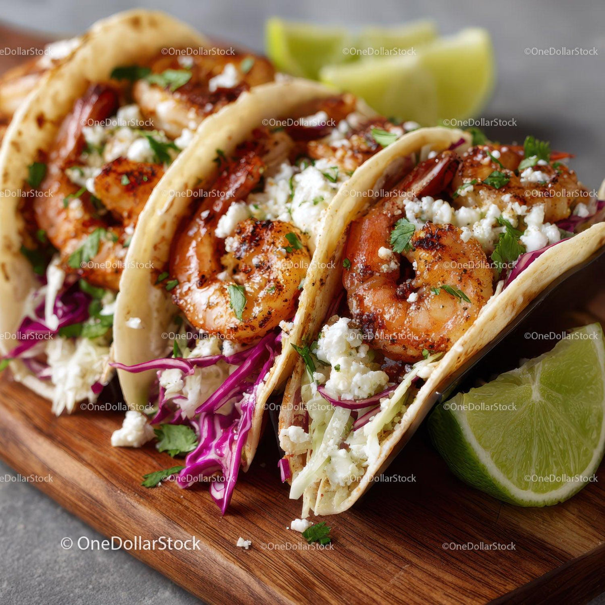 Seafood Shrimp Tacos with Fresh Vegetables and Lime Wedges