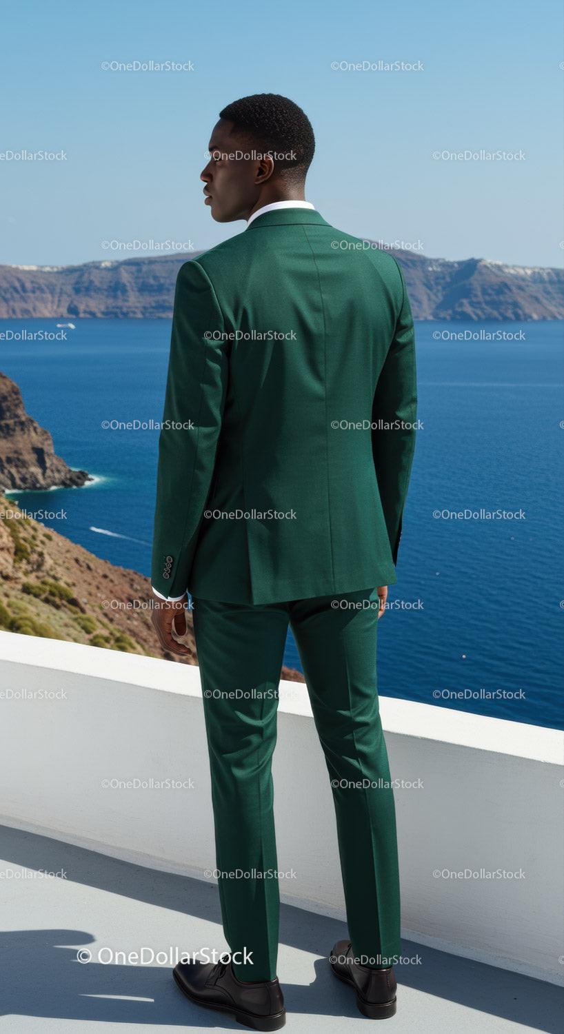 Man in Green Suit Overlooking Scenic Ocean View