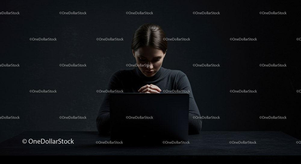Thoughtful Woman at Laptop in Dark Modern Workspace Stock Photo Bundle preview 7
