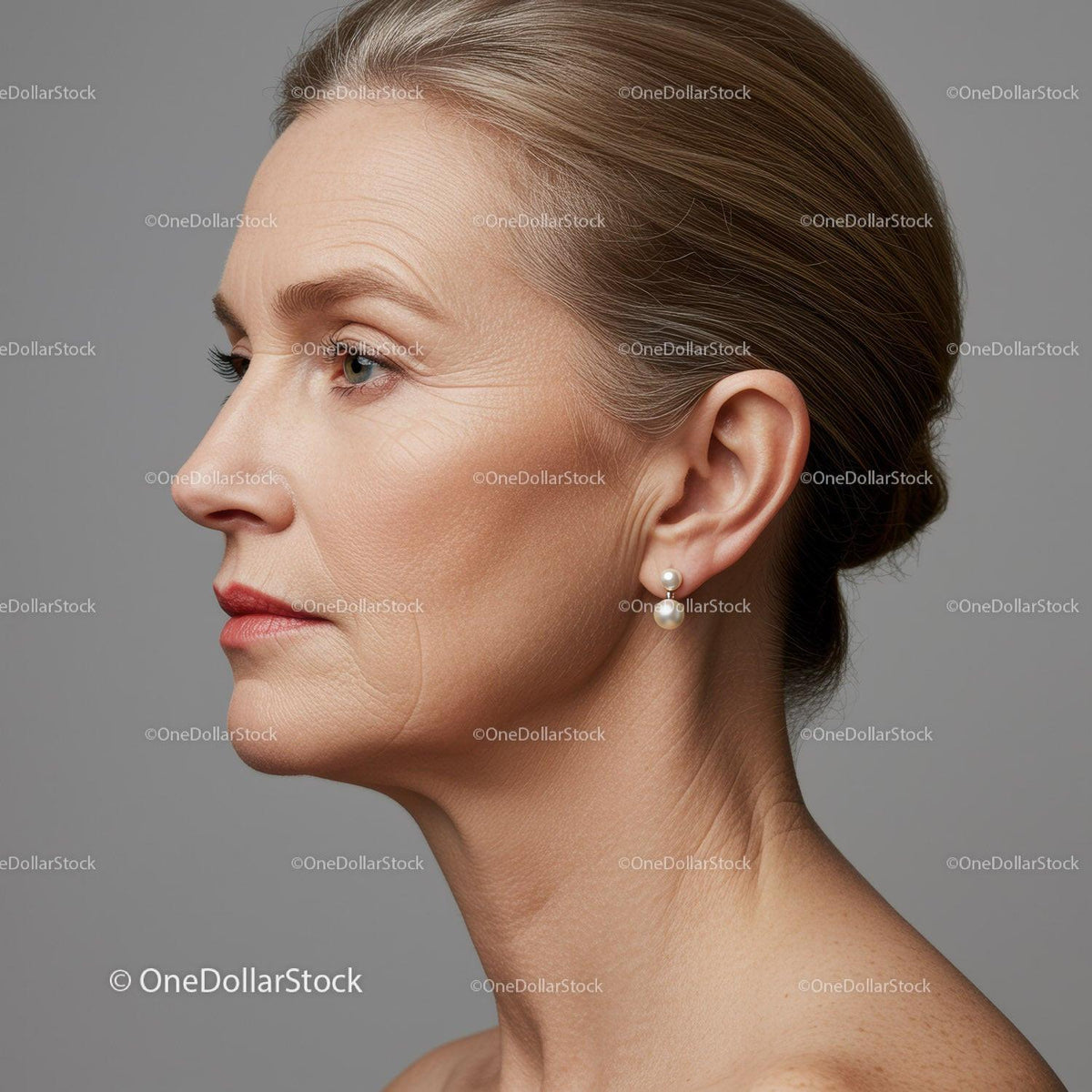 Elegant Mature Woman Side Profile with Pearl Earrings and Smooth Skin