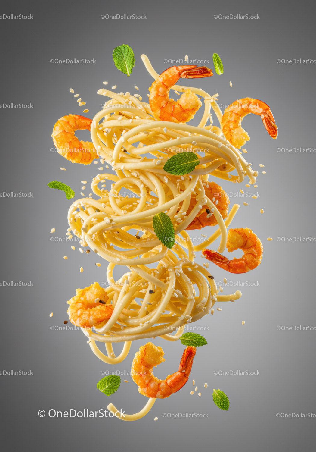 Floating spaghetti with shrimp, mint, and sesame seeds