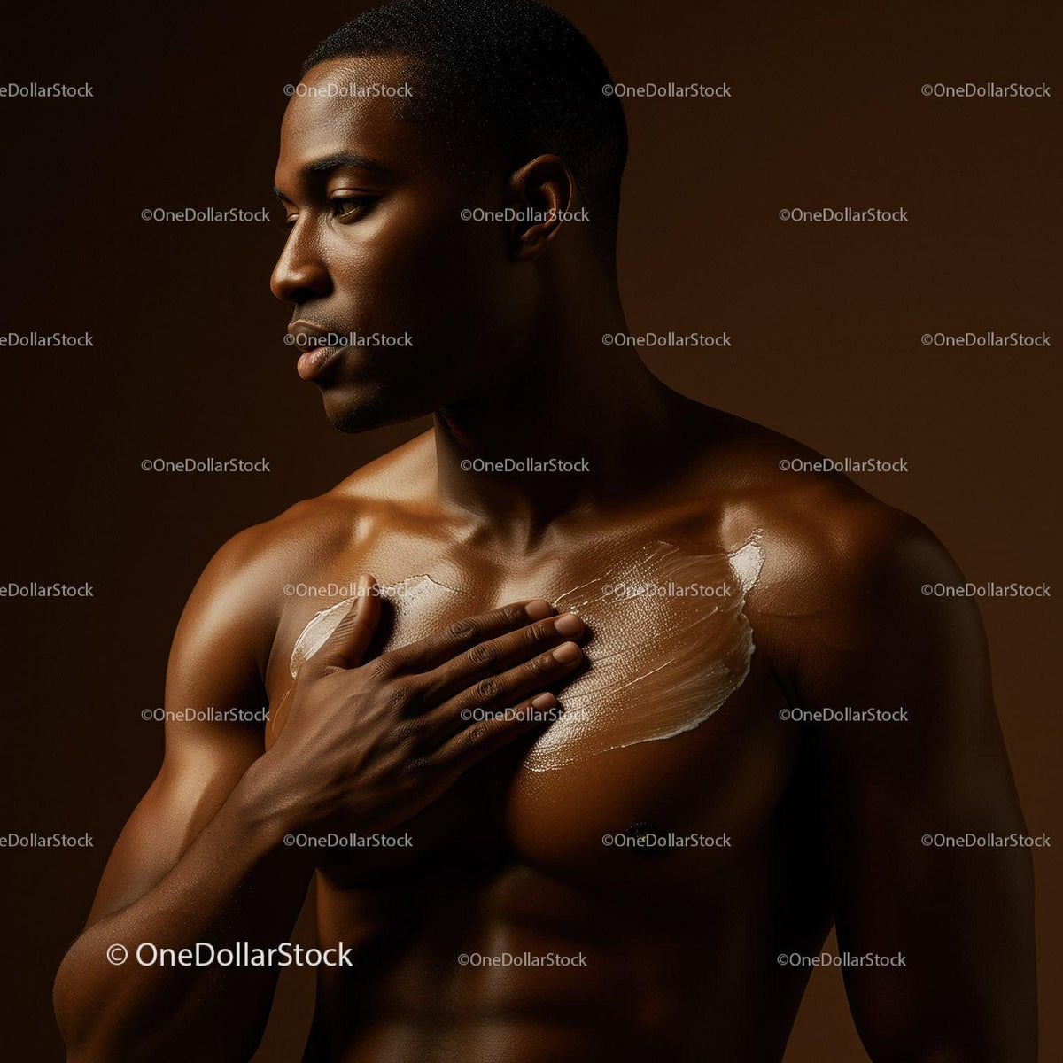 Male Model Applying Body Oil on Chest for Healthy Skin and Wellness