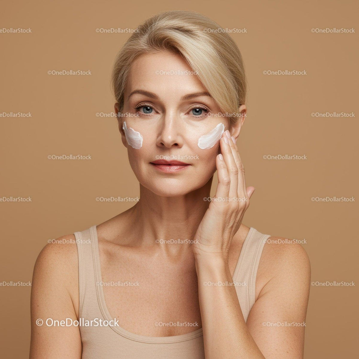 Elegant Woman Applying Face Cream for Flawless Skin