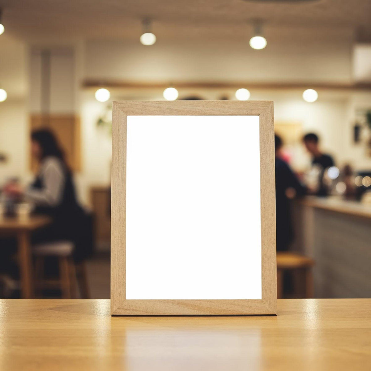 Blank Wooden Frame on Table in Cozy Cafe Interior JPG Mockup Image preview