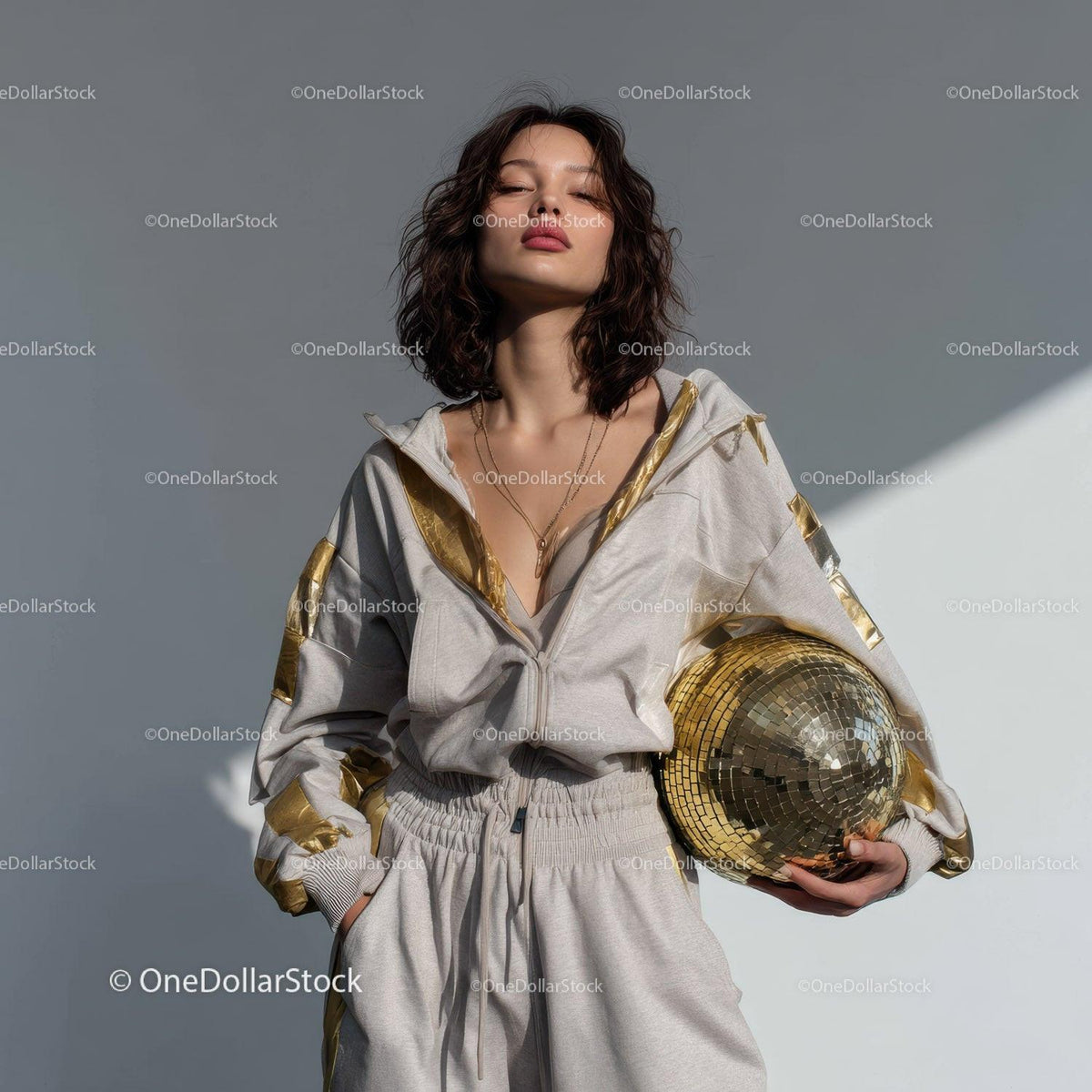 Stylish Woman in Metallic Outfit Holding Disco Ball for Modern Fashion Stock Photo Bundle preview 13