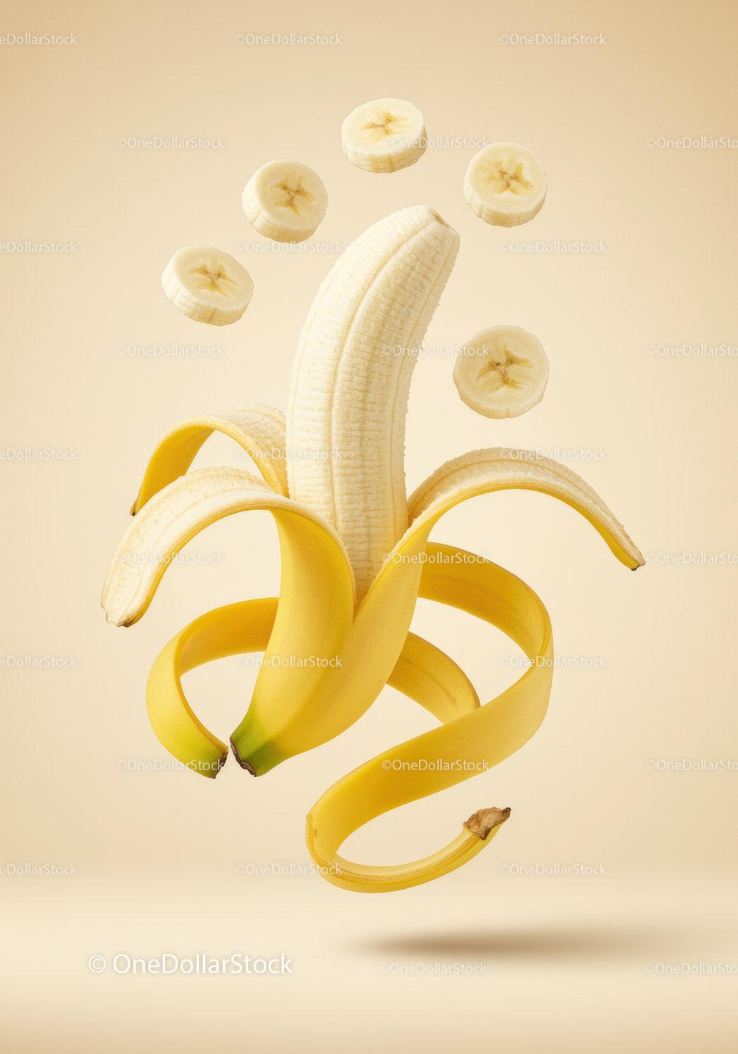 Peeled banana with floating banana slices on beige background