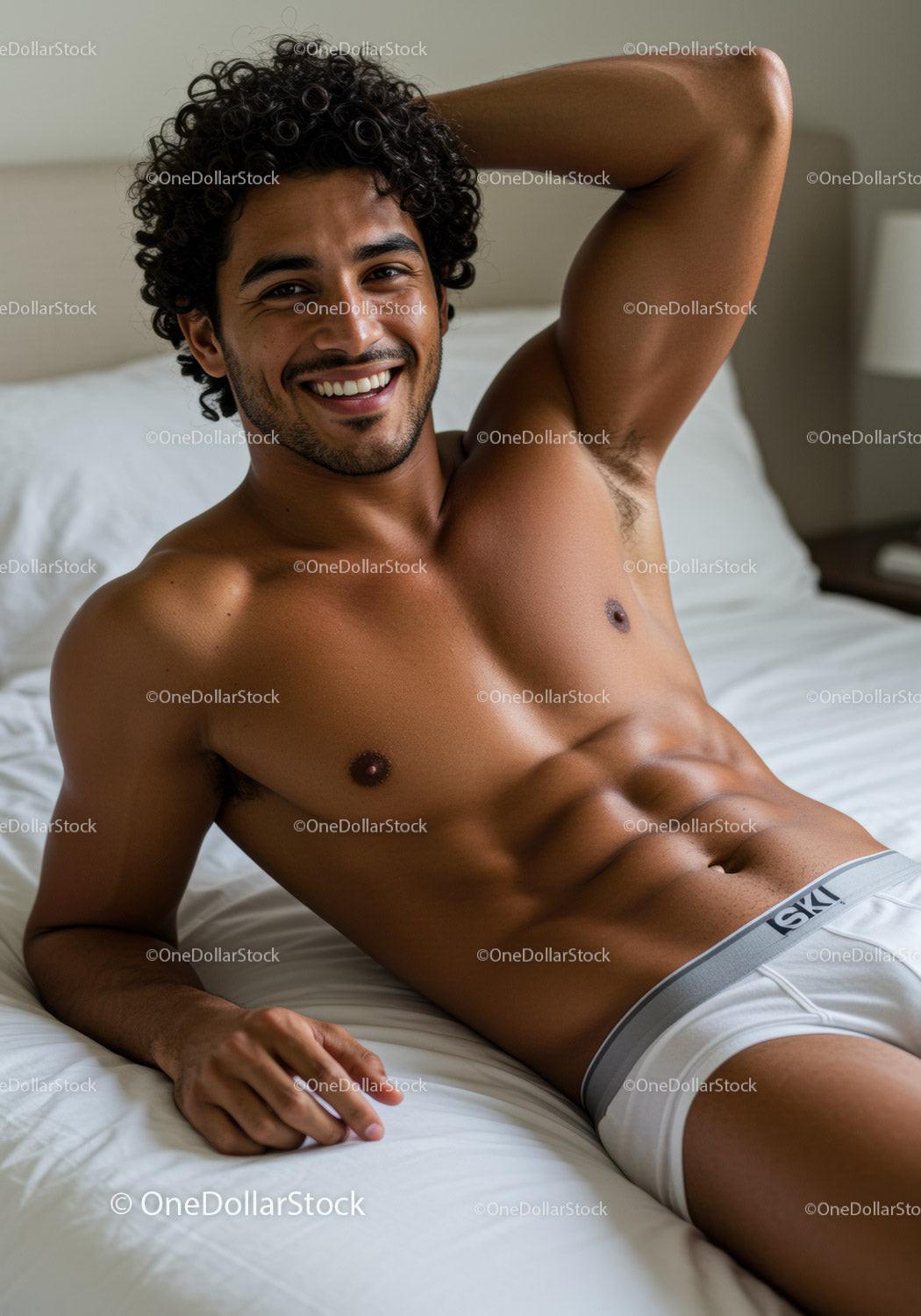Smiling man relaxing on bed in casual underwear