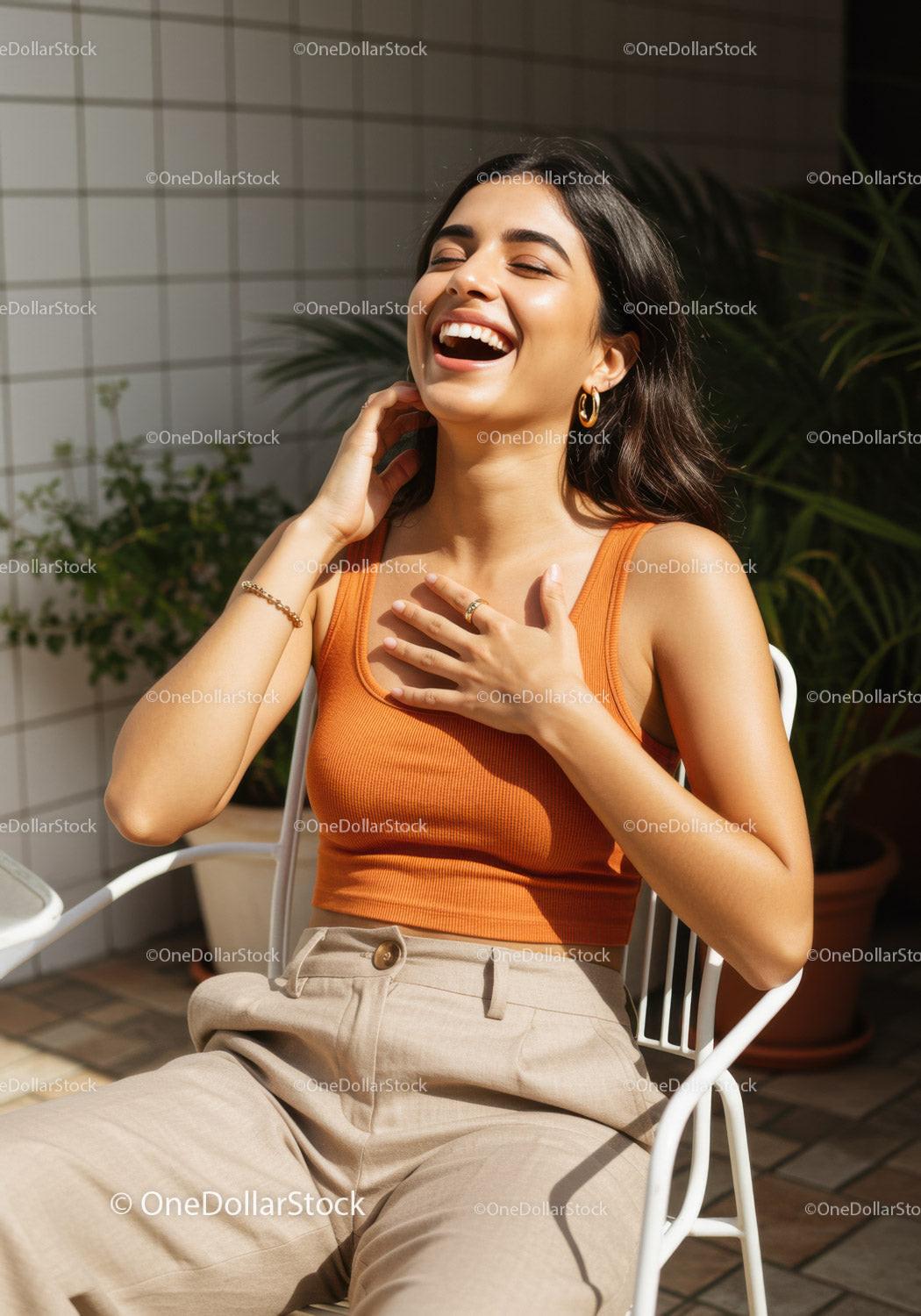 Joyful Woman in Orange Tank Top with Gold Jewelry Outdoors